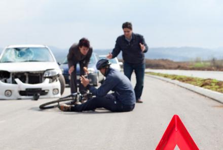 motorists check on injured cyclist