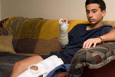 boy on couch with broken leg
